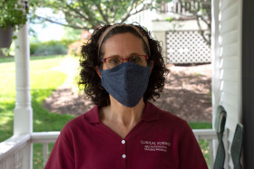Dr. Angela Scarpa outside her home donning a face mask